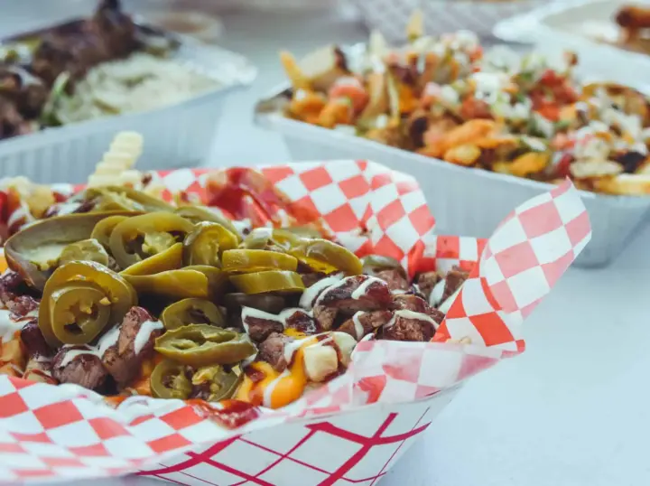 Close-up of loaded fries with jalapeños and tri-tip served by SactoMoFo at a community event in Sacramento. SactoMoFo offers mobile food services and hosts weekly events in the greater Sacramento area.
