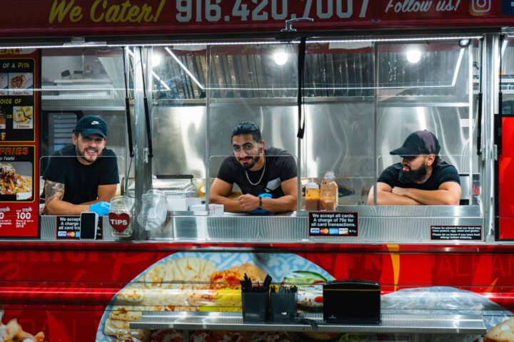 SactoMoFo food truck in Sacramento with three staff members ready to serve. Perfect for mobile foods and corporate catering events.